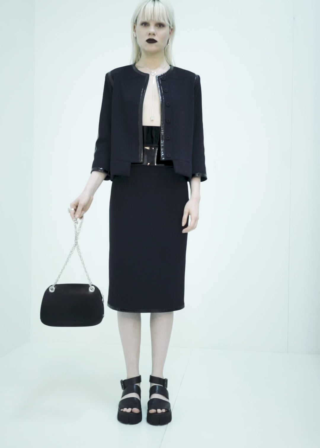 CARDIGAN COM VIVO DE VERNIZ